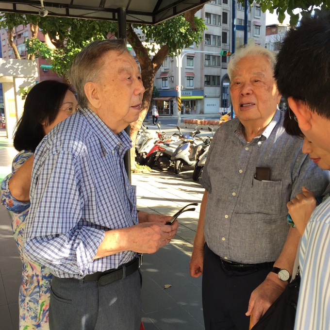 Two brothers chatting after lunch