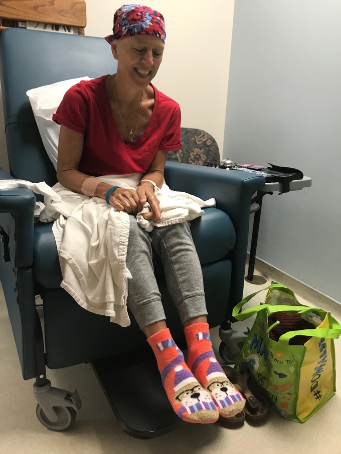 Tina at chemo wearing special socks