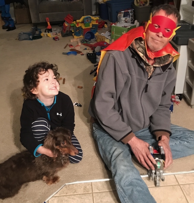 Paul playing superhero's with Elliot 