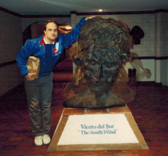 Ken imitates the sculpture