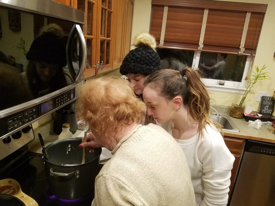 Mema teaching Aly & Lexi how to make pecan pralines 