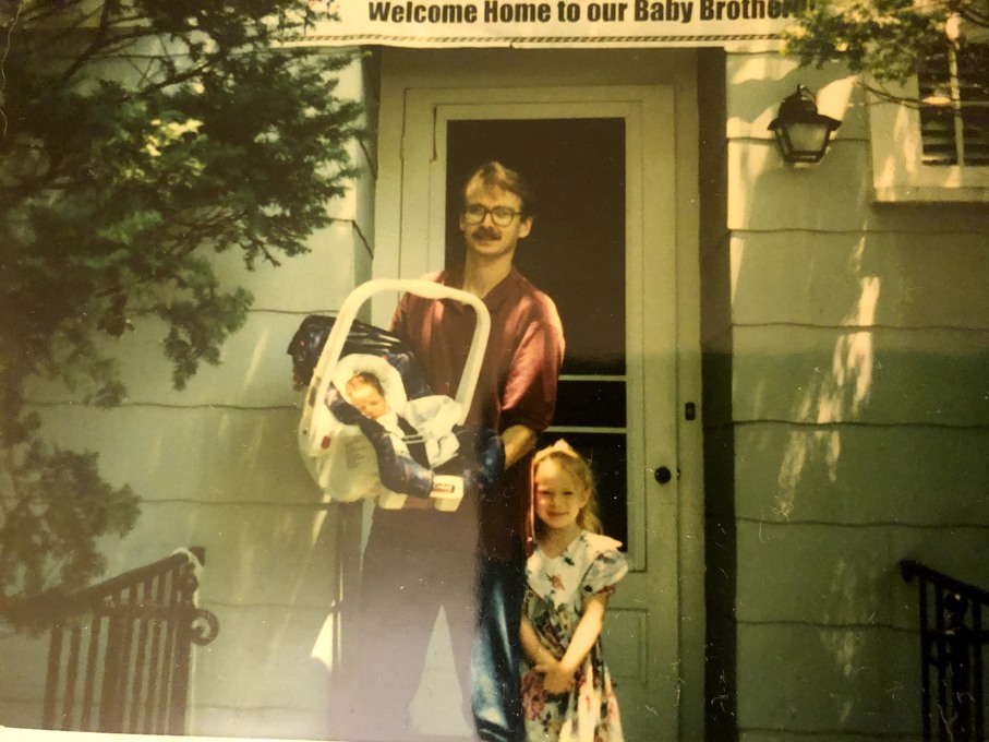 Mike and his daughter bringing home baby Daniel - 1996
