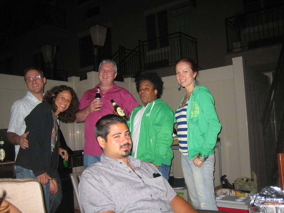 With co-workers/friends at a BBQ