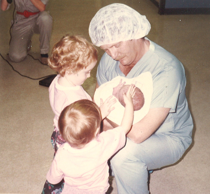 Michael holding newborn son 01/30/1987