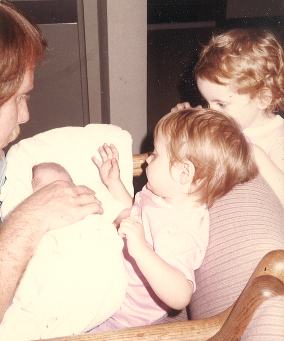 Michael holding newborn son 01/30/1987