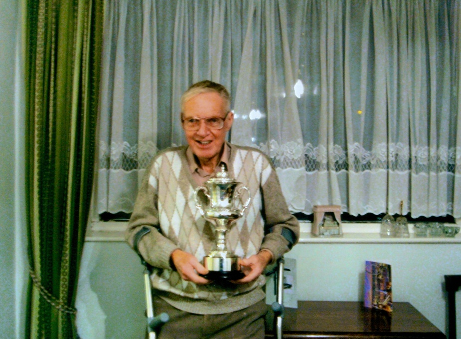 Eric receiving a trophy 