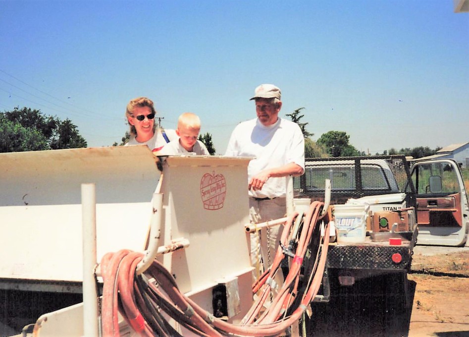 Howard's spray rig with Rachel and Wade.