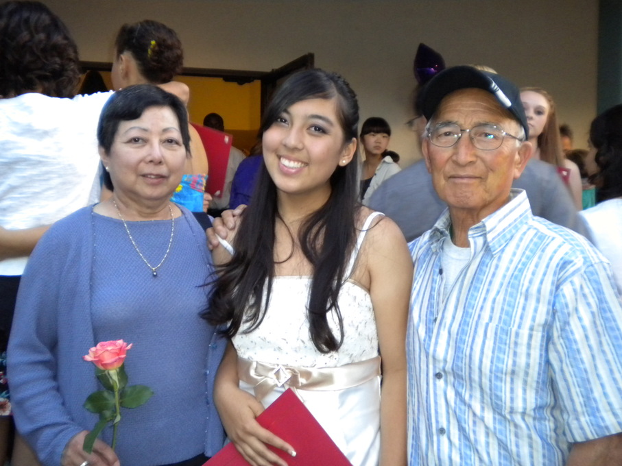 Carl and Jeanne with Taylor (granddaughter) at middle school graduation