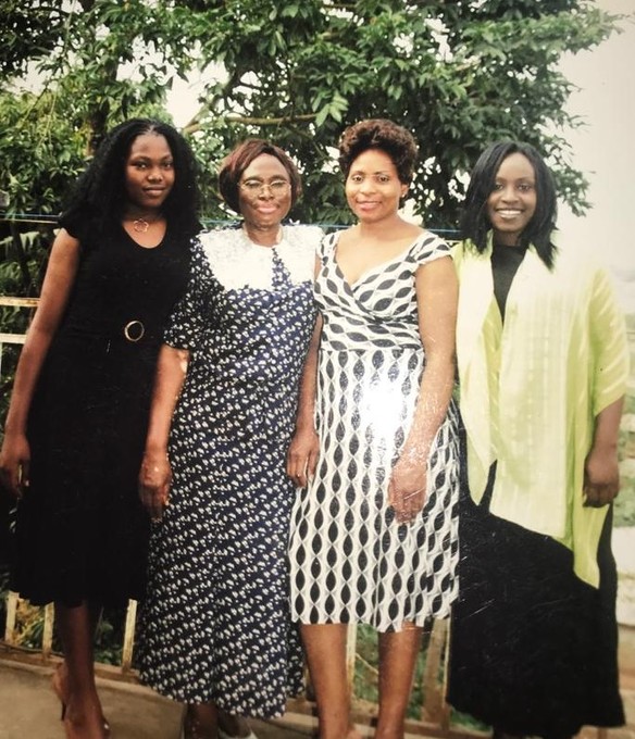 With daughters, Abong (left), Mavis (center), and Ebob.
