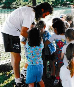 Coach Martin Volunteering at School Event