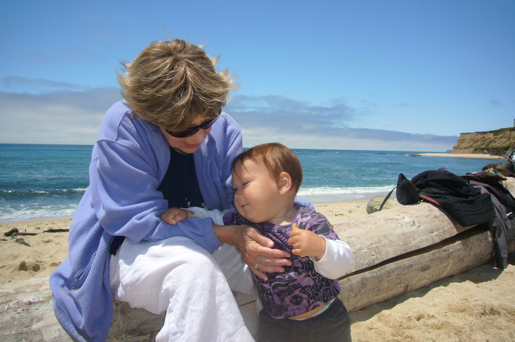 Snuggling baby Kieran on the beach in Half Moon Bay, 2010