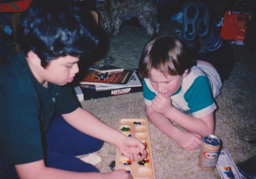 John and William Playing Mancala