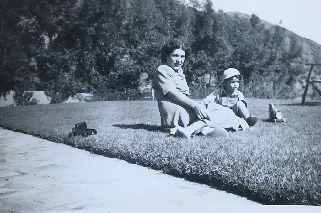 As a young boy with mum Antigone 
