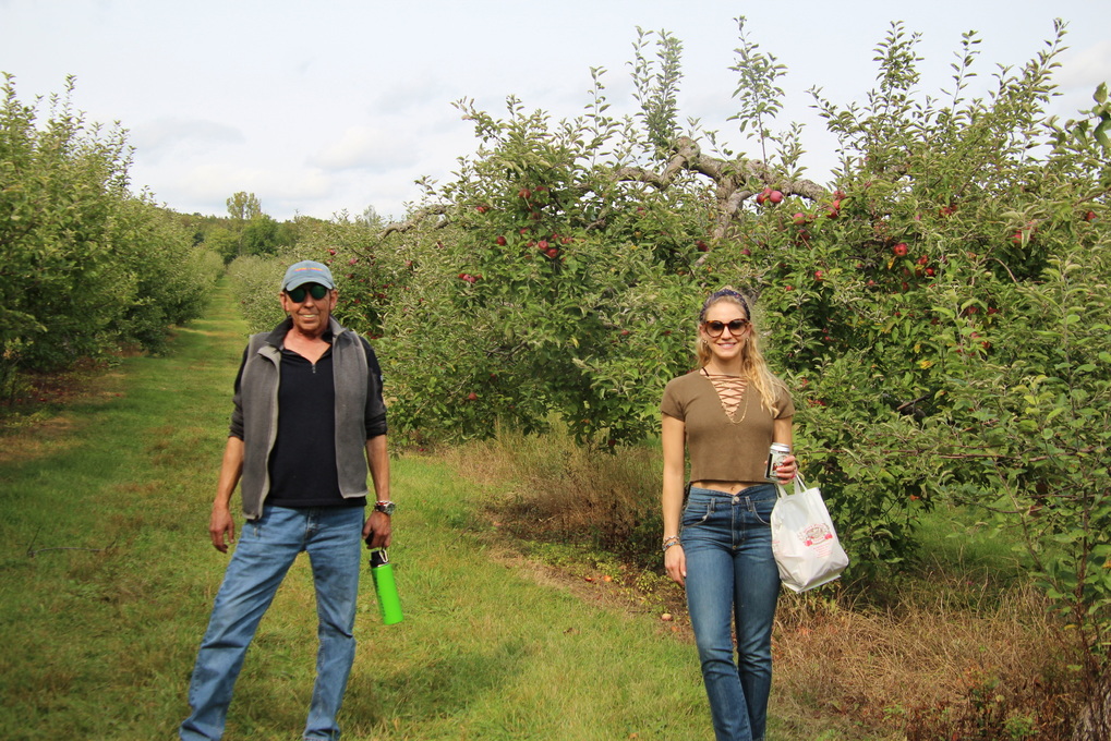 Apple picking with his daughter, Kelsey