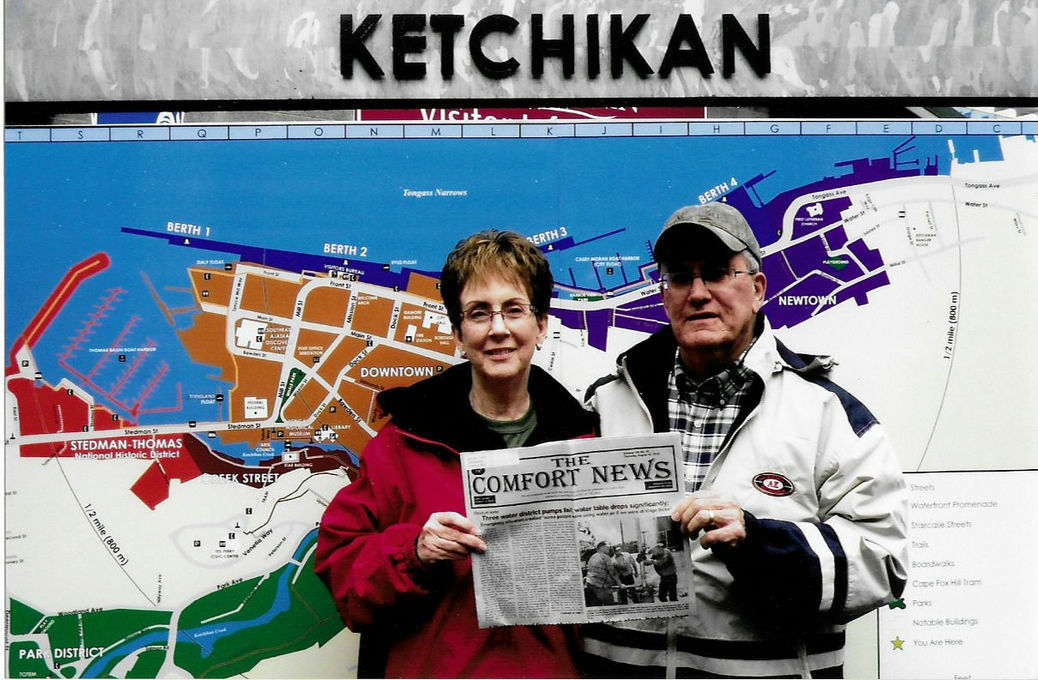 Gail and Jay show off The Comfort News on their Alaska trip in September 2012