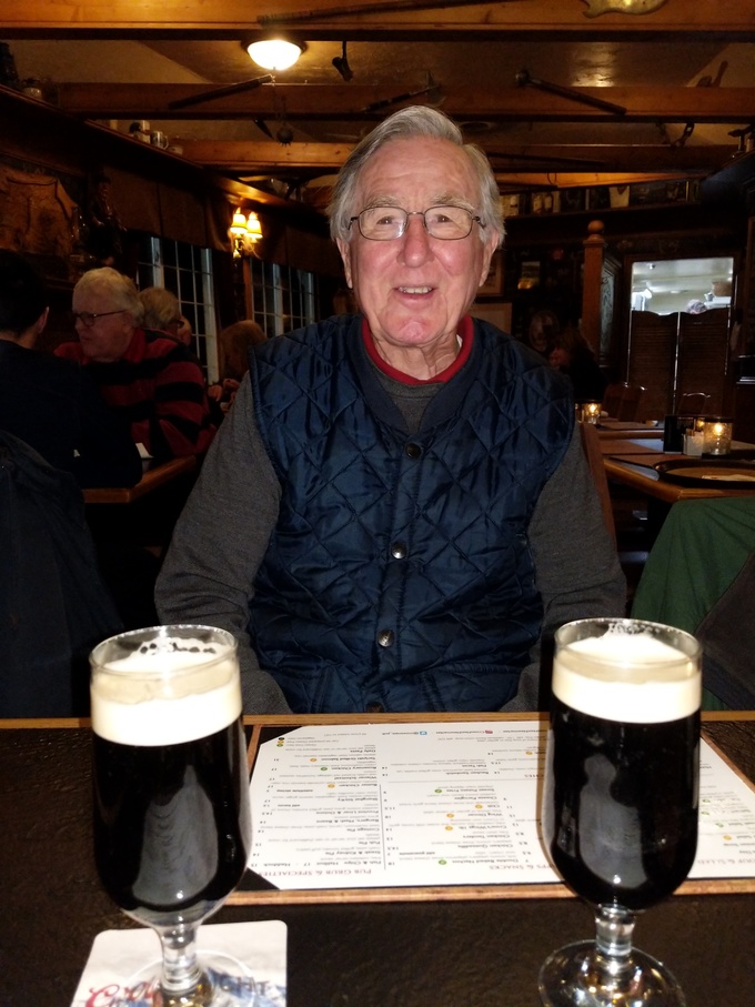 Having a Guiness with his daughters