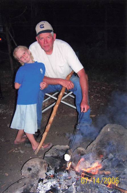 Kendra Branch hanging by the fire with Grandpa Howard